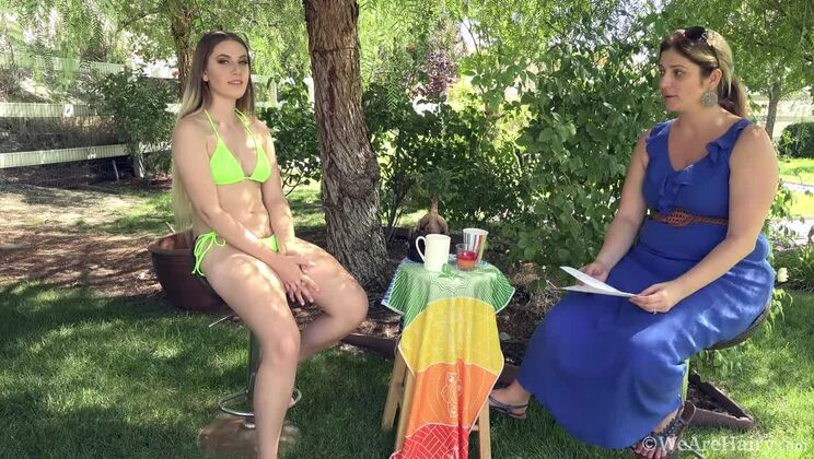 Niki Snow gets interviewed outdoors in her bikini