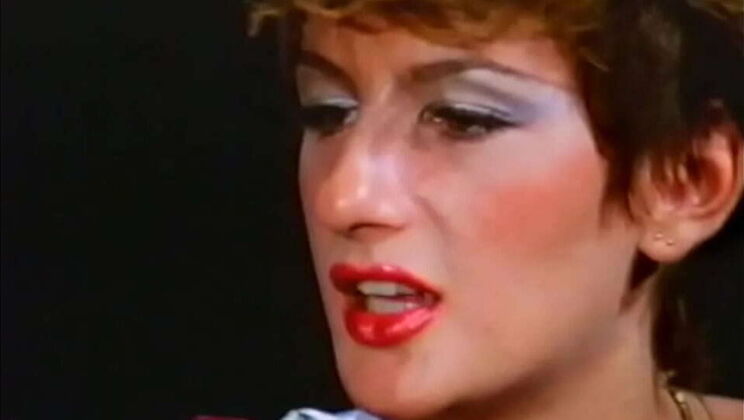 Blonde pornstar Sharon Mitchell deepthroats big cock for cum in mouth