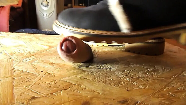 Domina crushes cock with high heels
